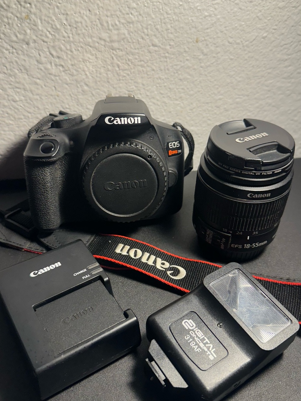 Canon EOS T6 Camera Kit in Black with Red-Trim Strap